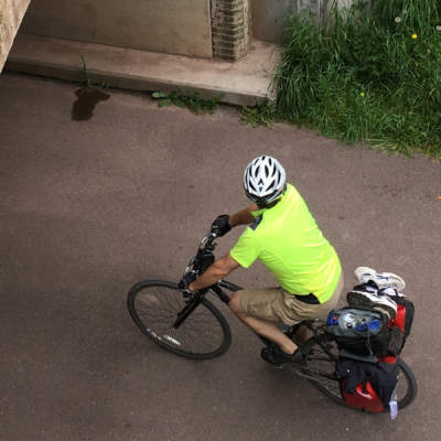 Cyclists biking under Eastern Continental Divide Tunnel