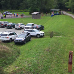 Parking lot with cars and people at Garrett