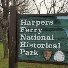 Sign for Harpers Ferry National Historical Park beside road